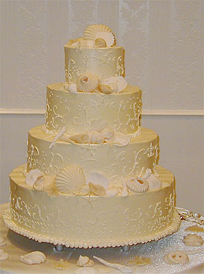 four layer round seashell wedding cake