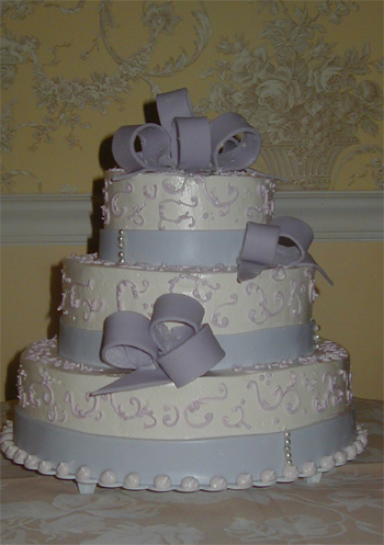 periwinkle blue cake with ribbons