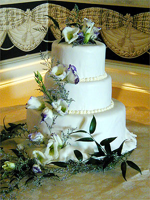 three layer cake with white flowers