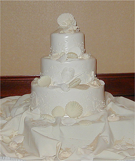 three layer pearl finish wedding cake with shells