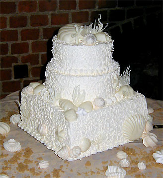 three layer shell cake in white and cream