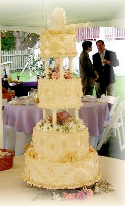three tier yellow cake with roses