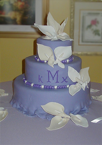3 layer purple cake with calla lilies and monogram