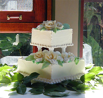 Two tier square cake with roses and beads