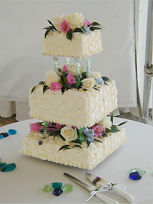 three tier basket cake with flowers