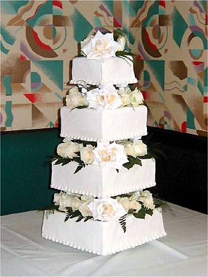 four tier square cake with roses