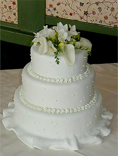 three layer white cake with flowers